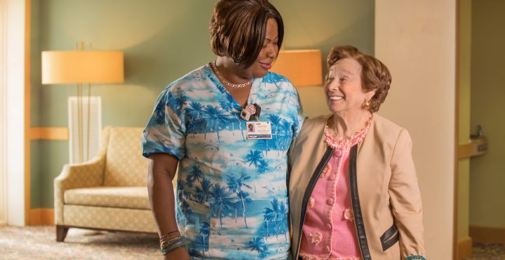 Elderly resident speaking with nurse
