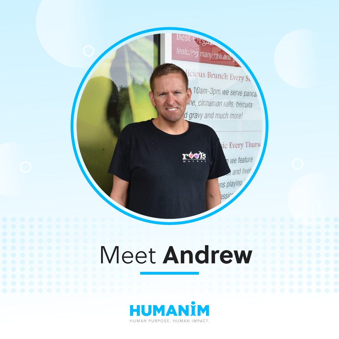 Picture of Andrew, adult male wearing a black shirt with the Roots Market logo. The picture is in a circle frame graphic with the text "Meet Andrew" under the picture.