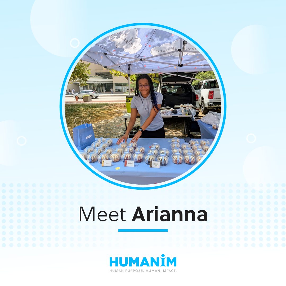 Light blue graphic frame with a picture in a circular frame. The picture is of a female high school student displaying cakes under a booth outside." Underneath the picture is text saying "Meet Arianna," with the Humanim logo underneath that.